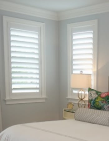 White plantation shutters with hidden tilt rods in Denver